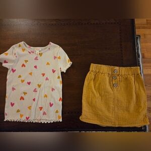 girl 8 golden yellow skirt with white top and hearts
